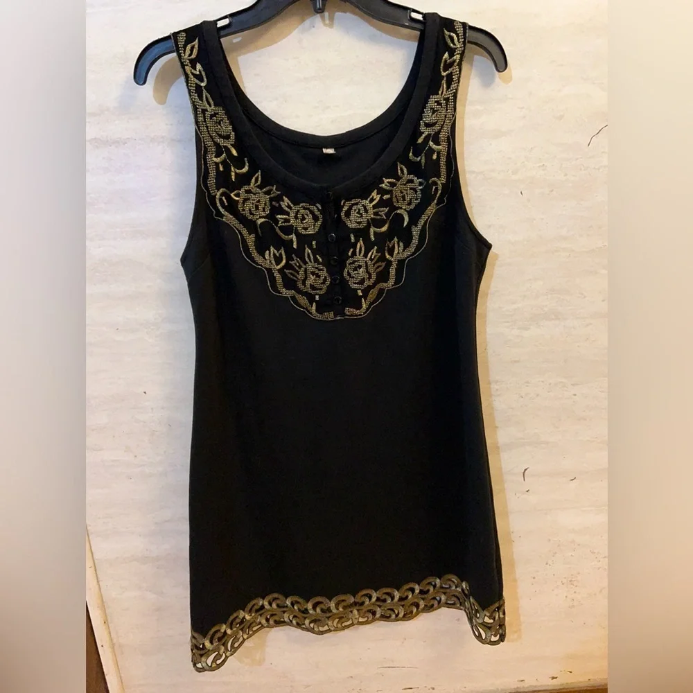 Free People sleeveless black dress with gold metallic embroidery.